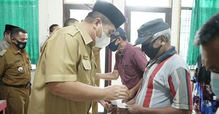 Pemkab Asahan Serahkan Bantuan Beras Kepada 1000 Kaum Dhuafa