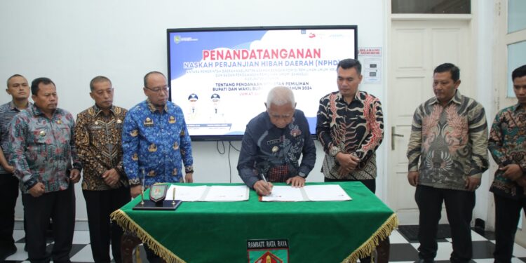 Pemkab Asahan dan  KPU Lakukan Penandatanganan NPHD