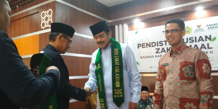 Baznas Kabupaten Karimun Distribusikan Zakat Maal, Nurdin Basirun dan Bupati Iskandar Jadi Duta Zakat