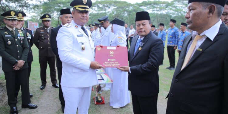 Wabup Asahan Rianto, Pimpin Upacara Penurunan Bendera HUT ke- 80 RI